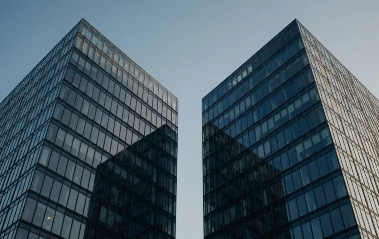 Deux tours de bureaux se faisant face, définition de la fusion-acquisition